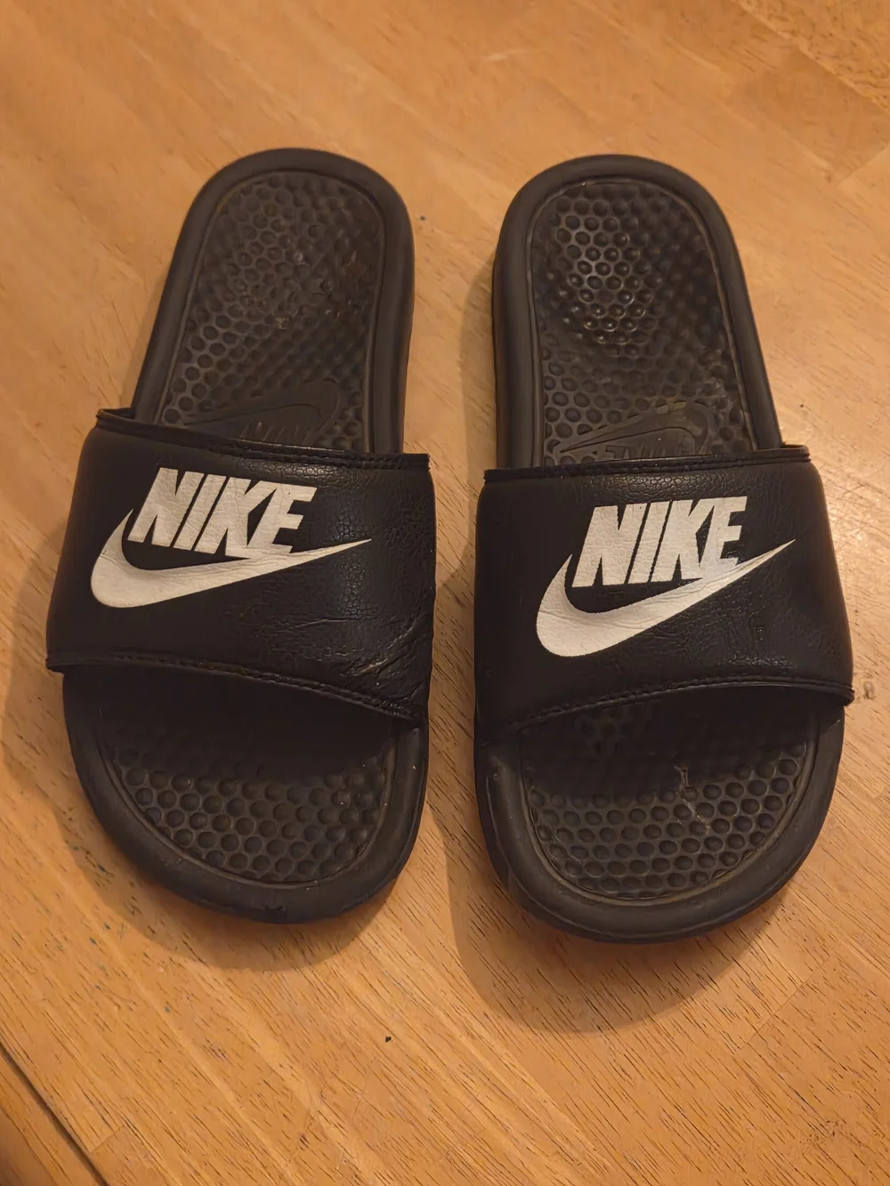Nike Black Slides with White Swoosh Logo